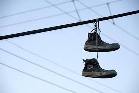 Converse Hanging On A Telephone Wire Google Search Hanging Shoes Shoe Tattoos Converse
