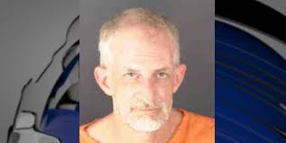 Man charged with stealing from elderly woman in his care