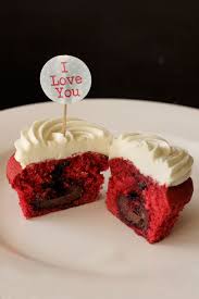 Red Velvet Surprise Cupcakes For Valentine S Day The Surprise Is A Lindor Truffle Hidden Inside Each Cupcake White Chocolate Icing Chocolate Icing Chocolate
