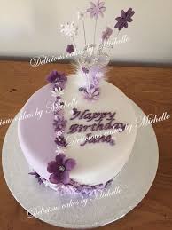 Add a festive balloon for an extra sweet. Purple Flower 65th Birthday Cake 65 Birthday Cake Purple Cakes Birthday Birthday Cake