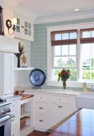 Kitchen With White Cabinets Aqua Backsplash And Tan Shades Susan Serra With Images Beach House Kitchens Coastal Kitchen Design Interior Design Kitchen