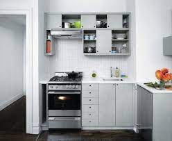 Designer tyler karu added a bright paint stripe on the brick wall so that the exposed brick doesn't feel too overwhelming. 14 Tricks For Maximizing Space In A Tiny Kitchen Urban Edition Remodelista Very Small Kitchen Design Kitchen Design Modern Small Small Kitchen Decor