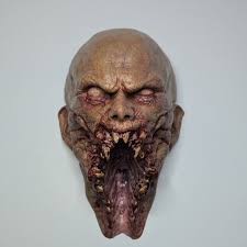 They'll be better compared after the right is finished with paint and hair,  but I wanted a side by side comparison of my 2 RZ Myers masks. Left was  sculpted by Russell