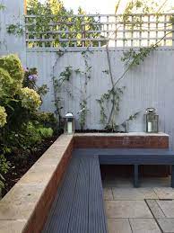 Check spelling or type a new query. Built In Garden Bench Seating Painted In Dark Grey With Contrasting Light Grey Fence Small Garden Fence Small Garden Design Small Garden