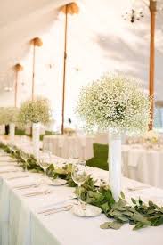 Garland With Lemon Leaves And Simple Babies Breath Www Gardendesignsbykri Wedding Centerpieces Wedding Reception Centerpieces Wedding Centerpieces Babys Breath