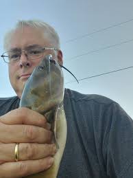 Some pictures of my pond and a couple fish I caught this evening.