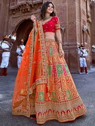 Embroidered Banarasi Silk Designer Lehenga Choli In Orange At ethnic plus, find the designer lehenga choli of your dreams!