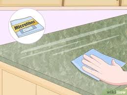 Sand the surface with a fine grit sandpaper such as #400 grit in order to create a good surface for the paint to adhere to. Simple Ways To Polish Corian Countertops 12 Steps With Pictures