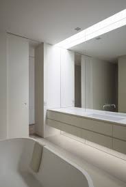 Mirrors can also be used to hide elements like a deep countertop cabinet or add a decorative flair to the room, similar to a piece of wall art. Bathroom Mirror Ideas Fill The Wall The Mirror In This Bathroom Reaches The Full Span Bathroom Mirror Design Large Bathroom Mirrors Small Bathroom Mirrors