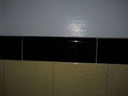 You can also lightly sand the tiles to help the paint adhere, but that really shouldn't be necessary if you are using a special bonding primer. Paint Color For A Bathroom With Old Yellow Black Tiles Hometalk