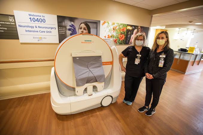 Point-of-care portable CT scanning in an ICU setting, AI generated