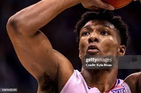 Oscar Tshiebwe of the Kentucky Wildcats takes a rebound away from... News  Photo