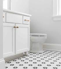 Spring pattern with butterflies and birds on apple flowers Penny Tile Arranged Into A Flower Pattern Black And White Floral Mosaic Floor Tile Fun Design White Van Penny Tiles Bathroom Penny Tile Black Floor Tiles