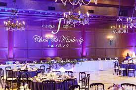 An Indoor Wedding Reception Is Stunning With Purple Lighting Crystal Chande Wedding Reception Lighting Indoor Wedding Receptions Wedding Reception Decorations