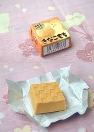 This is a mochi (japanese dumpling) chocolate covered with kinako coating, a kind of flavorful soybean flour commonly used in japanese cuisine, with a similar taste to peanut butter. Japanese Mochi Candy Mochi Chocolate Candy Wagashi
