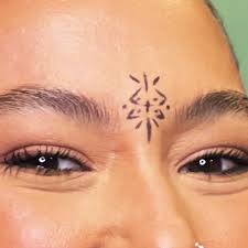 Image result for quirky pylon forehead tattoo