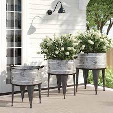 Anything galvanized (buckets, livestock troughs, tubs) wooden crates. Chacra 3 Piece Metal Pot Planter Set Farmhouse Landscaping Porch Planters Front Porch Planters