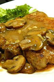Simmering Boneless Pork Chops In A Garlicky Mushroom Sauce Is A Great Dinner Idea For Valentine S Day Pork Chop Recipes Baked Pork Recipes Pork Dishes