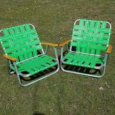 Beach chairs sit low to the ground, so you can lounge comfortably with your toes in the sand and listen to the waves crash. Two Vintage Aluminum Webbed Folding Wood Handle Low Lawn Beach Chair Green Pair Green Chair Beach Chairs Wood Handle