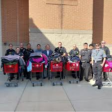 title MCPD's Community Engagement Division and District Community Services  Officers went shopping for winter coats to distribute to kids in need  across their districts! Thanks to a generous donation from the Montgomery