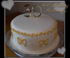 I used the white cake frosting i recipe to frost and for the filling between the two layers i mixed 2/3c raspberry preserves with 2t grand marnier. Simple 50th Anniversary Cake Cakecentral Com