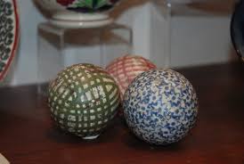 Black and white decorative ceramic carpet balls and wire basket. Buckhaven Carpet Bowls Fife Contemporary