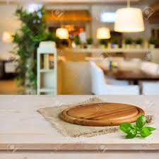 Vector cutting board and knife. Cutting Board On Table Over Blurred Restaurant Interior Background Stock Photo Picture And Royalty Free Image Image 37834903