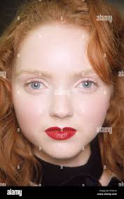 Robert Cary Williams Backstage London Ready to Wear Autumn Winter British  model Lily Cole wearing bright red lipstick, looking Stock Photo