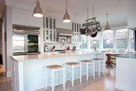 Is A White Kitchen Layout Good For Winter Or Summer The Answer Is Both Kitchendesign Designideas White Coastal Kitchen New England Kitchen Kitchen Decor