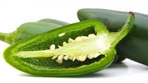 Halve the jalapeño lengthwise for removing the seeds with a spoon. This Trick Makes Cutting Jalapenos A Breeze