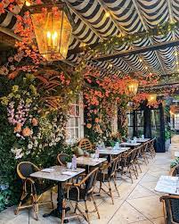 Chairish By Design On Instagram Swooning Over This Floral Wall Dallowayterrace By Gulsh In 2021 Cafe Exterior Outdoor Restaurant Design Cafe Interior Design