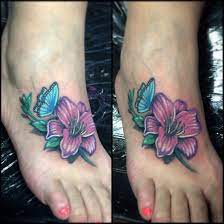 Lilly Flower And Butterfly Foot Tattoo Butterfly Foot Tattoo Foot Tattoo Lilly Flower