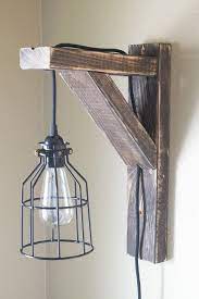 The corbel lights come with chords & a simple hanging system on the back so we simply drilled a hole in the center window pane of each window before hanging the corbel light on the center. How To Make Easy Corbel Sconce Lights For Your Bedroom Dwelling In Happiness Kids Bedroom Furniture Sconce Lighting Simple Chandelier