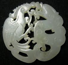 A translucent celadon glaze resembles jade while monochrome colors frequently used include white, blue, copper red, green, turquoise, and yellow. Antique Chinese Jade Carving Of Dragon And Phoenix