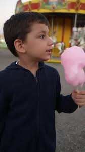 Multiethnic Children Eating Cotton Candy At Amusement Park 4K Stock Video