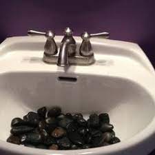 River rocks make a plain metal sink look good. So Putting Rocks In The Sink Y All Do That Lipstick Alley