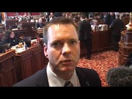 Sen. Charles Schneider, R-West Des Moines, reacts to Sen. Bill Dix's  resignation