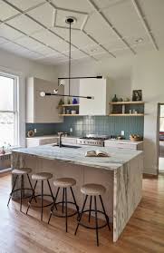 Contemporary orange kitchen with zebrawood cabinets and island. 64 Stunning Kitchen Island Ideas Architectural Digest