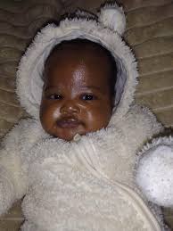 When do we shave off their first hair? At what age do we?