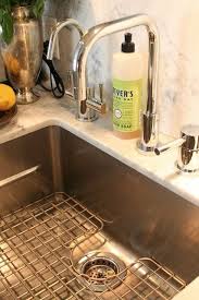 We have the champagne bronze drain flange/stopper in the farmhouse sink, and i'm looking for a (close) match for a sink grid/protector. 6 Things You Need To Know About Undermount Kitchen Sinks Undermount Kitchen Sinks Kitchen Sink Remodel Farmhouse Sink Kitchen