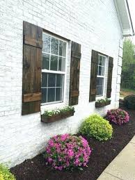 Black Wood Shutters Shutters For House Wood Rustic Exterior Cedar Board And Batten Far Wood Shutters Exterior Exterior Paint Colors For House Shutters Exterior