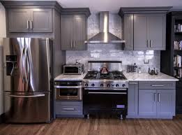 Kitchen Renovation With Stainless Steel Appliances Gray Marble Countertop And Recessed Pa Kitchen Colour Schemes Maple Cabinets Black Stainless Steel Kitchen