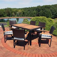 It comprises a single table, with 5 to 6 chairs, depending on the number that you. Sunnydaze Carlow Outdoor Dining Set 7 Piece Rattan And Acacia Outside Patio Furniture 1 Table And 6 Chairs With Thick Seat Cushions Multiple Colors Available Walmart Com Walmart Com