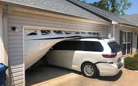 The remaining panels and tracks are held in place with hinges, brackets, and screws. Lilburn Garage Door Repair Lilburn Overhead Door Repairs