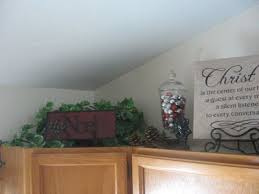 Dandelions And Dust Bunnies A Little Dollar Spot Goodness Decorating Above Kitchen Cabinets Holiday Inspiration Christmas Kitchen Cabinets Decor