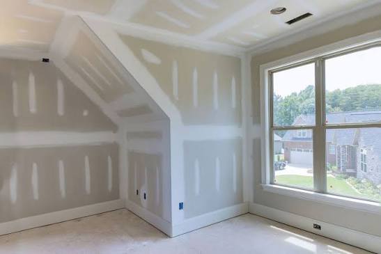 Interior walls and ceiling with new drywall ready for finishing