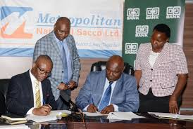 L R Putting Pen To Paper The Director Cooperatives Banking At Co Op Bank Vincent Marangu With The Leadership Of Metro Metropolitan Leadership Life Is Good
