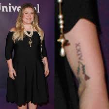 Grunge zine with temporary tattoo inside! Kelly Clarkson S 14 Tattoos Meanings Steal Her Style