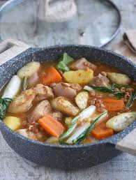 Pork Pochero Is The Ultimate Comfort Food Chockful Of Tender Pork Belly Beans Smoky Sausage Vegetables And Rich T Slow Cooker Recipes Pork Pork Pork Belly