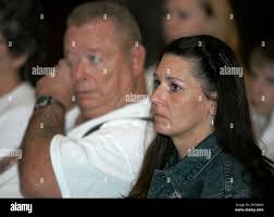 Beth Proctor, widow of Sgt. Joseph E. Proctor, sits with her father-in-law,  Lloyd Proctor, during a ceremony where her late husband was awarded a  posthumous Silver Star medal, Wednesday, Dec. 20, 2006,